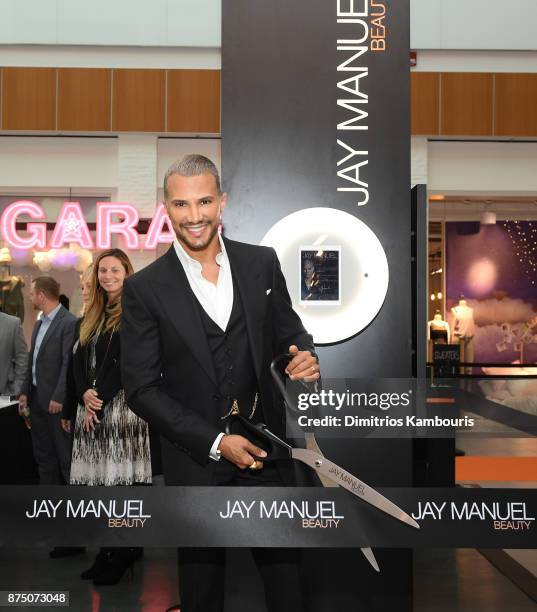 Jay Manuel cuts the ribbon during Jay Manuel Beauty, Grand Opening at Roosevelt Field Mall on November 16, 2017 in Garden City City.