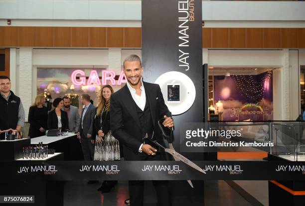 Jay Manuel cuts the ribbon during Jay Manuel Beauty, Grand Opening at Roosevelt Field Mall on November 16, 2017 in Garden City City.