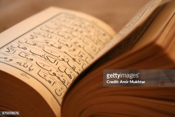 holy book (quran) - koran stock pictures, royalty-free photos & images