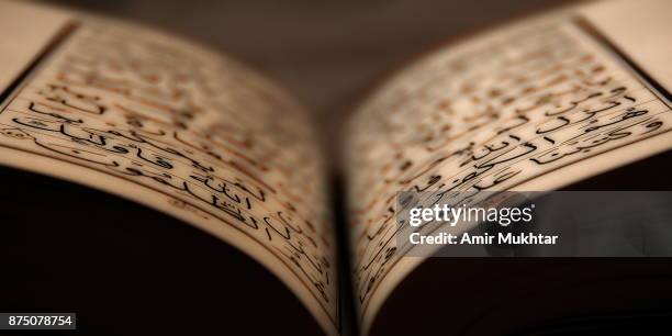 holy book (quran) - koran stock pictures, royalty-free photos & images