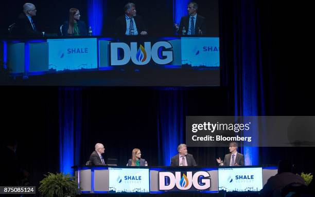 Richard Mason, chief technical director of Hart Energy LLC, from left, Beth McDonald, vice president of South Texas asset team for Pioneer Natural...
