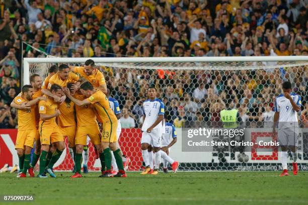 Mile Jedinak of the Australia celebrates with teammates after scoring the first goal during the 2nd leg of the 2018 FIFA World Cup Qualifier between...