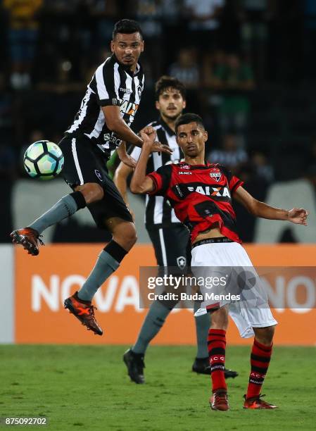 Rodrigo Lindoso of Botafogo struggles for the ball with Jorginho of Atletico GO during a match between Botafogo and Atletico GO as part of...
