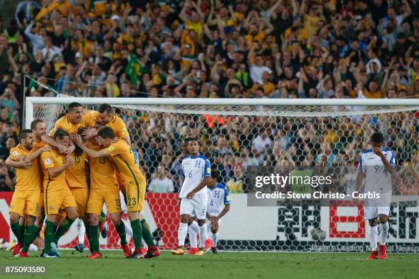 Mile Jedinak of the Australia celebrates with teammates after scoring the first goal during the 2nd leg of the 2018 FIFA World Cup Qualifier between...