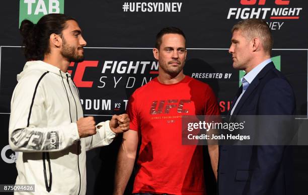 Opponents Elias Theodorou of Canada and Daniel Kelly of Australia face off during the UFC Ultimate Media Day at the Hilton Sydney Hotel on November...