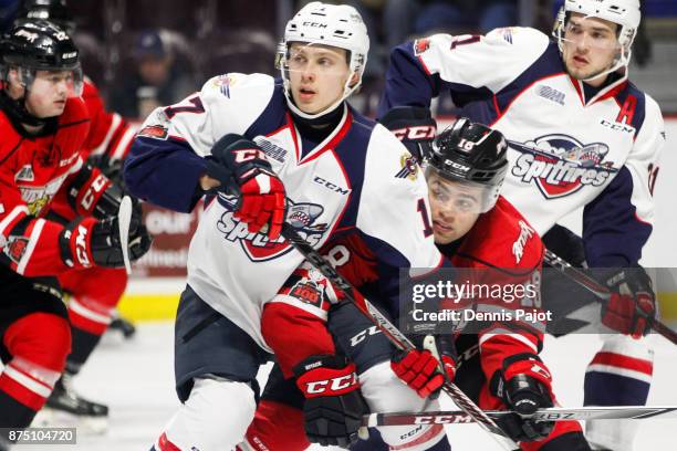 Defenceman Markus Phillips of the Owen Sound Attack battles against forward Igor Larionov of the Windsor Spitfires on November 16, 2017 at the WFCU...