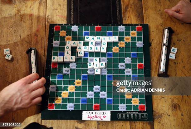 Participants play "Dirty Scrabble, an event during which singles can get to know each other, at Smith's Cocktail bar in west London on November 7,...