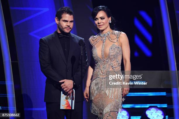 Marco de la O and Maribel Guardia speak onstage at the 18th Annual Latin Grammy Awards at MGM Grand Garden Arena on November 16, 2017 in Las Vegas,...