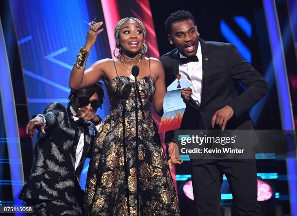 Miguel "Slow" Martinez, Gloria "Goyo" Martinez and Carlos "Tostao" Valencia of ChocQuibTown speak onstage at the 18th Annual Latin Grammy Awards at...