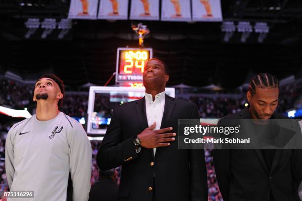 Former Spurs David Robinson with Derrick White and Kawhi Leonard of the San Antonio Spurs stand for the National Anthem before the game against the...