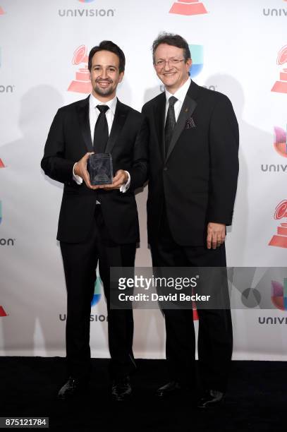 Lin-Manuel Miranda and Latin Recording Academy President/CEO Gabriel Abaroa pose in the press room during The 18th Annual Latin Grammy Awards at MGM...