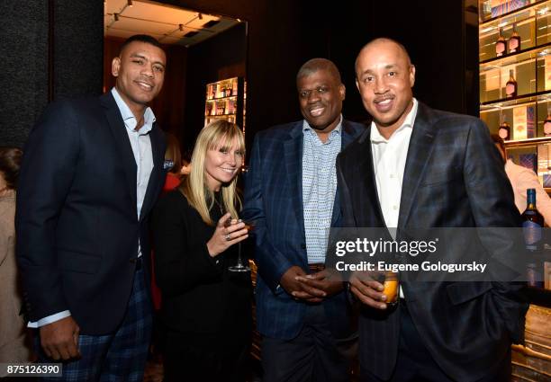 Allan Houston, Talia Handler, Bernard King and John Starks at the launch of Jose Cuervo Reserva De La Familia Hardwood Edition. A limited-edition...