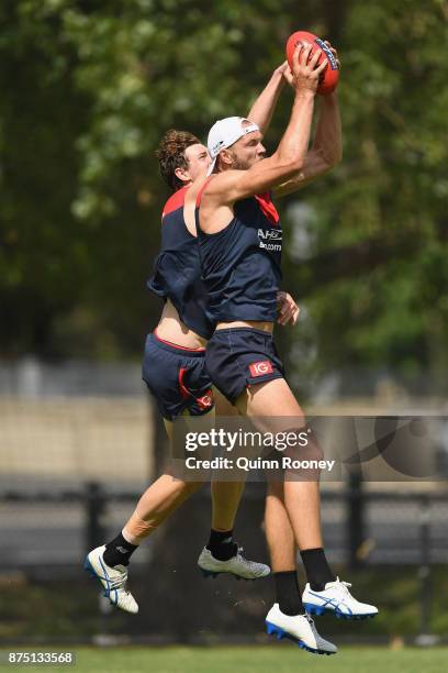 Max Gawn of the Demons marks infront of Mitchell King during a Melbourne Demons AFL training session at Gosch's Paddock on November 17, 2017 in...