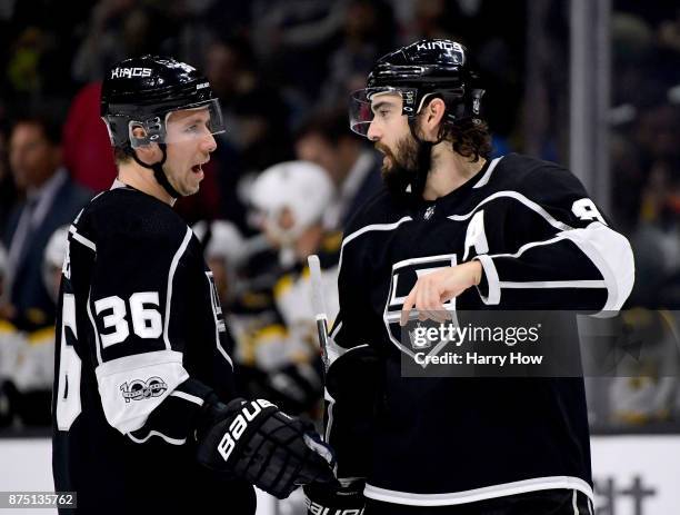 Drew Doughty of the Los Angeles Kings speaks to Jussi Jokinen of the Los Angeles Kings during the first period against the Boston Bruins in his first...