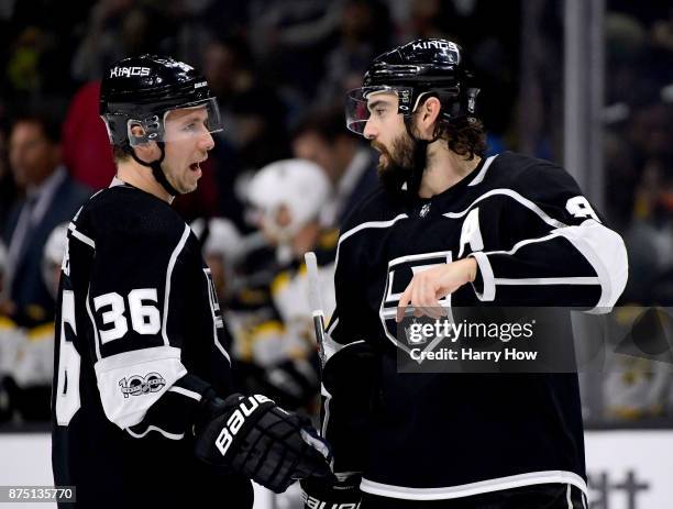 Drew Doughty of the Los Angeles Kings speaks to Jussi Jokinen of the Los Angeles Kings during the first period against the Boston Bruins in his first...