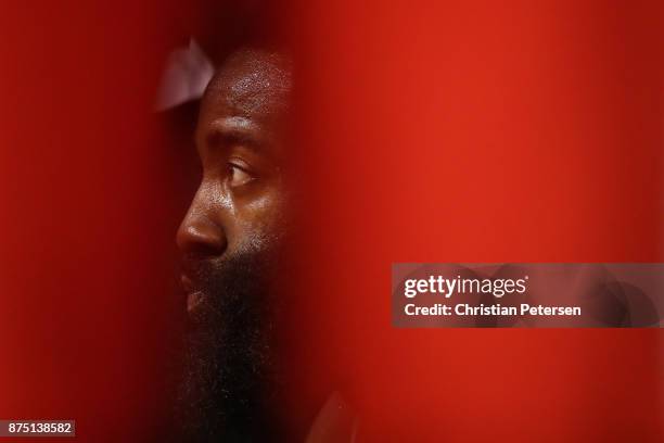 James Harden of the Houston Rockets sits on the bench during the first half of the NBA game against the Phoenix Suns at Talking Stick Resort Arena on...