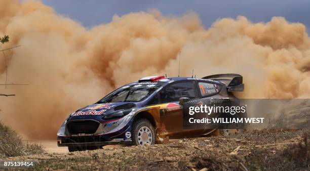Ford driver Sebastien Ogier of France powers through a corner on the first day of World Rally Championship event Rally Australia near Coffs Harbour...