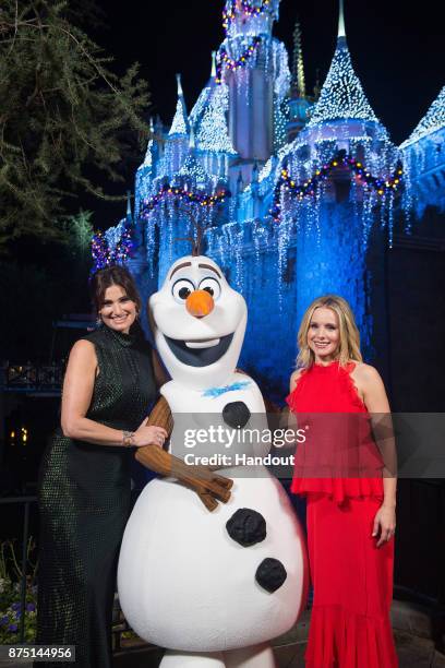 In this handout photo provided by Disney Parks, Idina Menzel and Kristen Bell of "Frozen" pose with Olaf before a taping of "The Wonderful World of...