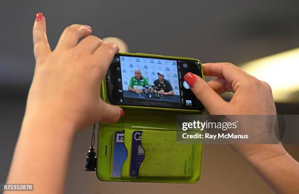 Perth , Australia - 11 November 2017; Ireland team manager Joe Kernan and the Australian manager Chris Scott, reflected in a smart phone, during the...