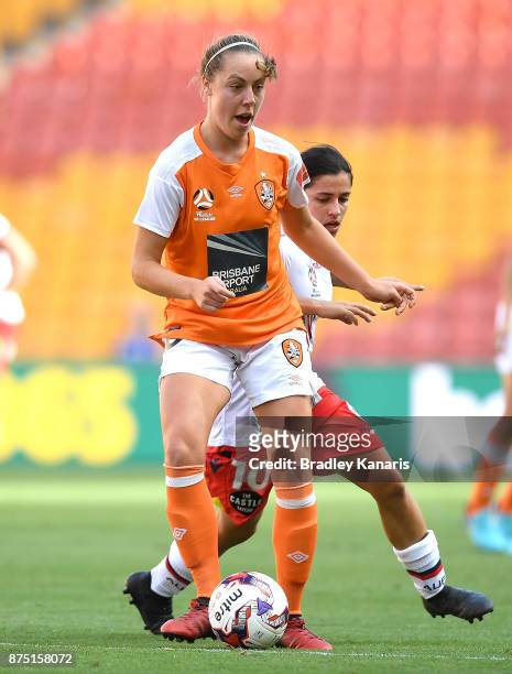 Celeste Boureille of the Roar breaks away from the defence of Alexandra Chidiac of Adelaide United during the round four W-League match between...