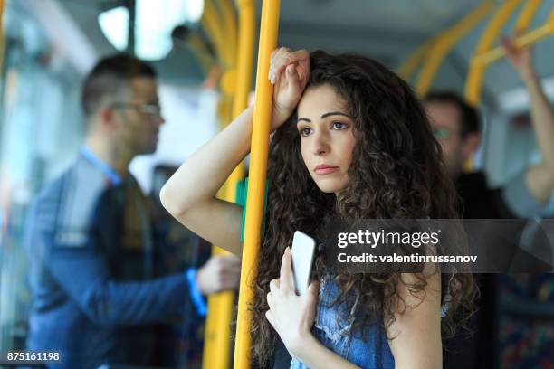 orolig ung kvinna reser inne i en buss - hot women bildbanksfoton och bilder