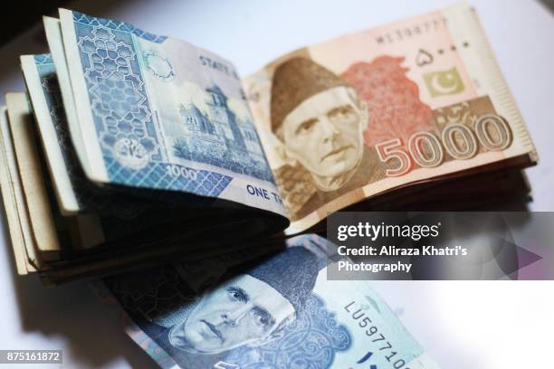 pakistani currency - pakistan currency stock pictures, royalty-free photos & images