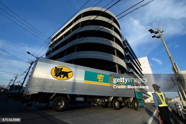 Yamato Transport Co. Truck enters the Yamato Holdings Co. Atsugi Gateway distribution center in Aikawa, Kanagawa, Japan, on Monday, Nov. 13, 2017....