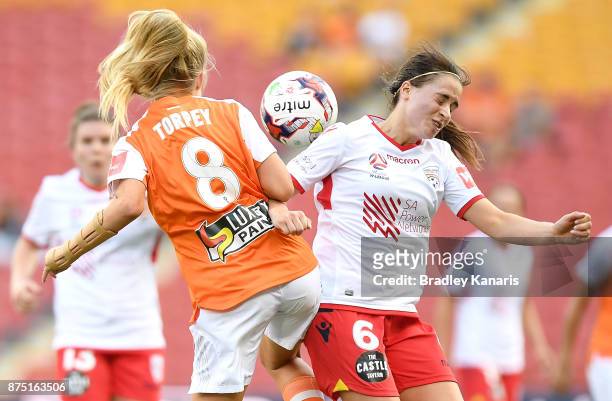 Kaityln Torpey of the Roar and Georgia Campagnale of Adelaide United challenge for the ball during the round four W-League match between Brisbane and...