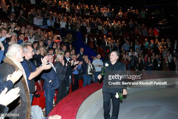 Jean-Paul Belmondo and Antoine Dulery applausing Gerard Depardieu who acknowledges the applause of the audience and gives flowers to his fans at the...