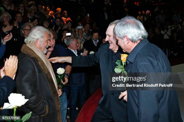 Gerard Depardieu and Pianist Gerard Daguerre acknowledge the applause of the audience and gives flowers to Jean-Paul Belmondo and Antoine Dulery at...