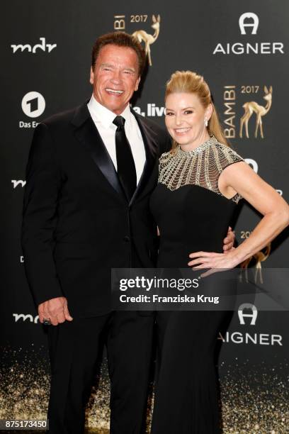 Arnold Schwarzenegger and his partner Heather Milligan arrive at the Bambi Awards 2017 at Stage Theater on November 16, 2017 in Berlin, Germany.