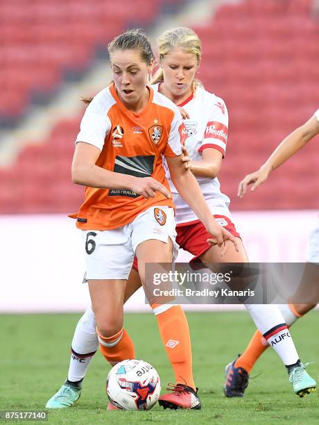 Celeste Boureille of the Roar is challenged by Makenzy Doniak of Adelaide United during the round four W-League match between Brisbane and Adelaide...