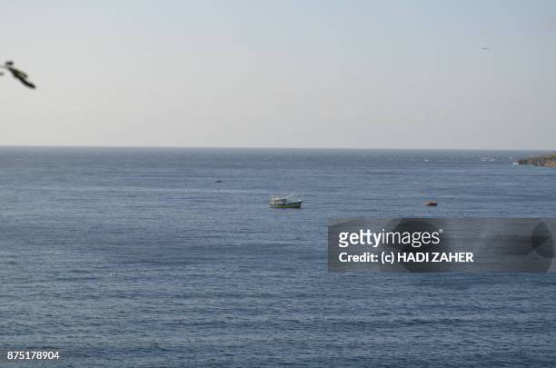 asylum seeker boat anchored just off christmas island | australia - anchored boats stock pictures, royalty-free photos & images