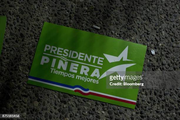 Discarded banner for presidential candidate Sebastian Pinera sits on the ground during a campaign rally in Santiago, Chile, on Thursday, Nov. 16,...