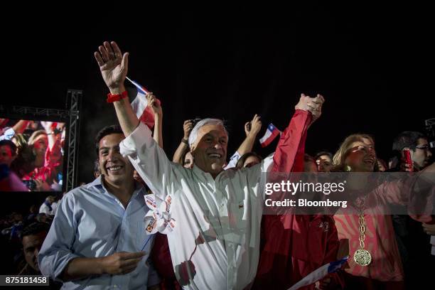 Presidential candidate Sebastian Pinera, center, stands with supporters during a campaign rally in Santiago, Chile, on Thursday, Nov. 16, 2017....