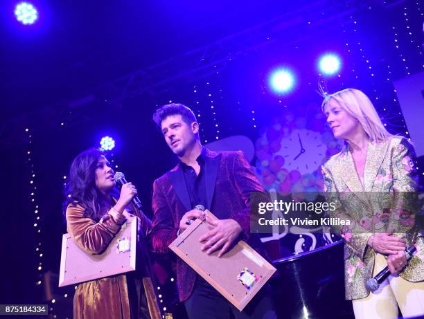 Vanessa Lachey, Robin Thicke and the Mayor of Beverly Hills Lili Bosse attend The Annual Rodeo Drive Holiday Lighting Celebration on November 16,...
