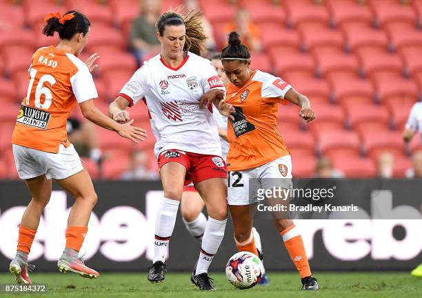Allira Toby of the Roar and Kathleen Naughton of Adelaide United challenge for the ball during the round four W-League match between Brisbane and...