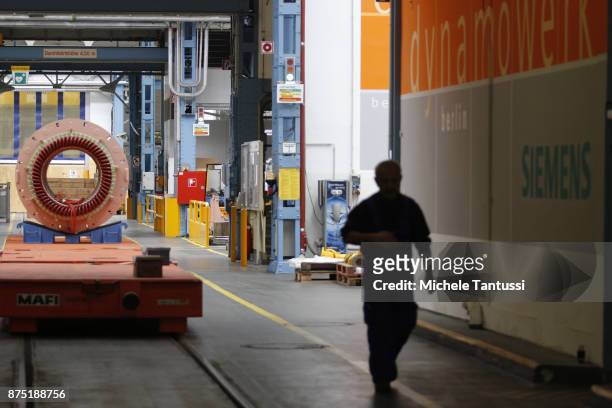 Workers in the Siemens Dynamowerk production Plant on September 28, 2010 in Berlin, Germany. Siemens has announced large-scale layoffs that will...