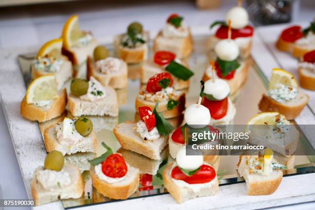 dessert buffet in a traditional italian wedding - buffet stock-fotos und bilder