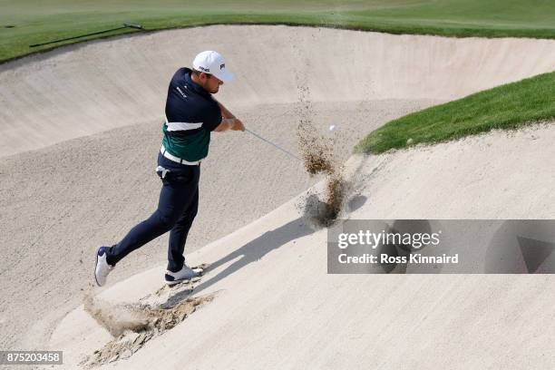 Tyrrell Hatton of England hits his third shot on the 18th hole during the second round of the DP World Tour Championship at Jumeirah Golf Estates on...