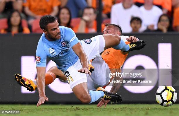 Emmanuel Muscat of Melbourne City and Eric Bautheac of the Roar challenge for the ball during the round seven A-League match between Brisbane Roar...