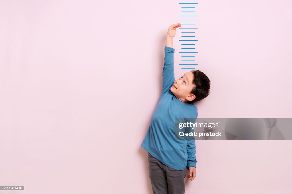 Child measuring his height