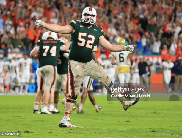 Miami offensive lineman KC McDermott reacts after kicker Michael Badgley converts the 24-yard game-winning field goal with four seconds remaining in...