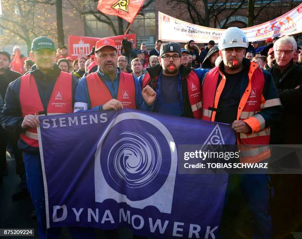 Employees of German industrial conglomerate Siemens demonstrate at Siemens' famed "Dyanomowerk" site in Berlin to protest against restructuring plans...