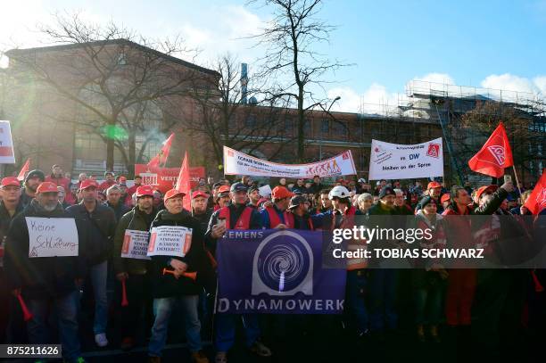 Employees of German industrial conglomerate Siemens demonstrate at Siemens' famed "Dyanomowerk" site in Berlin to protest against restructuring plans...
