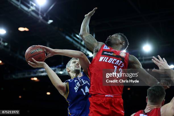 Daniel Kickert of the Bullets shoots while Derek Cooke Jr of the wildcats defends during the round seven NBL match between Brisbane and Perth at...