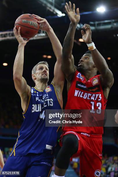 Daniel Kickert of the Bullets shoots while Derek Cooke Jr of the wildcats defends during the round seven NBL match between Brisbane and Perth at...