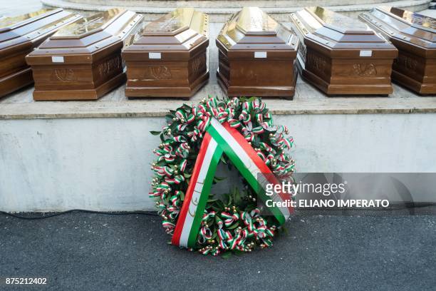 Wreath of flowers is seen next to the coffins of 26 teenage migrant girls found dead in the Mediterranean in early November, in the cemetery of...