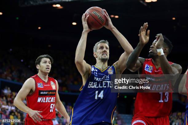 Daniel Kickert of the Bullets shoots while Derek Cooke Jr of the wildcats defends during the round seven NBL match between Brisbane and Perth at...