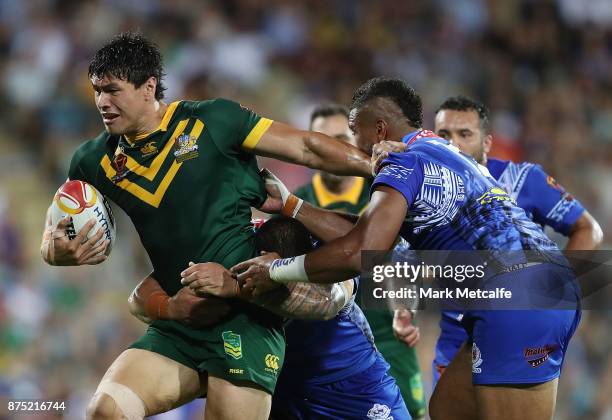 Jordan Mclean of Australia is tackled during the 2017 Rugby League World Cup Quarter Final match between Australia and Samoa at Darwin Stadium on...